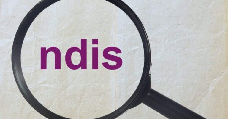 The letters "ndis" in purple on crumpled paper under a magnifying glass.