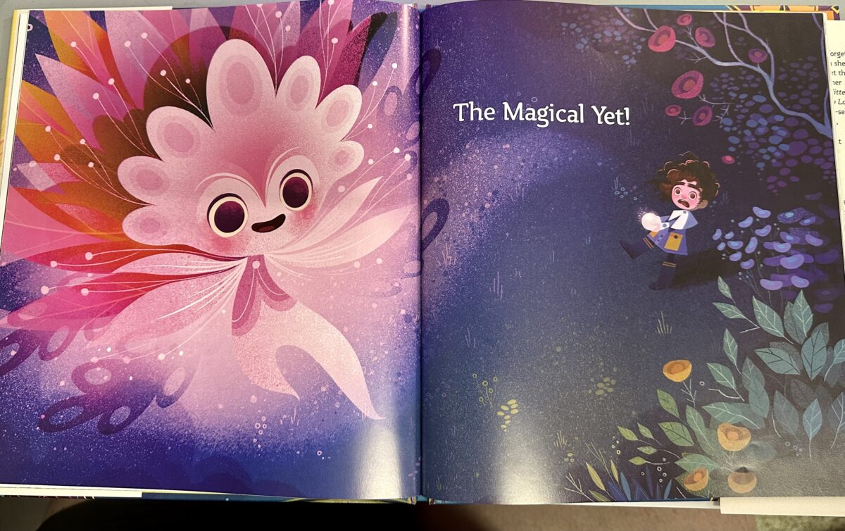 An open page from The Magical Yet featuring an illustration of a girl with brown curly hair holding a glowing object, and looking, shocked and afraid, at the large, pink, smiling creature with amny leafy wings in the foreground.