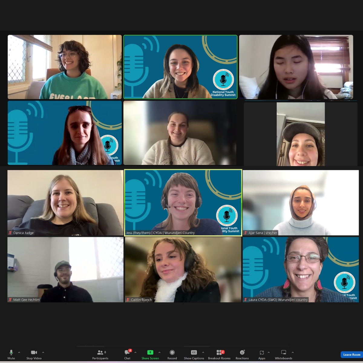 12 people in a Zoom meeting smiling for the cameras. Four of them have backgrounds with National Youth Disability Summit branding including a teal and orange logo and graphics of a microphone and a wheel.