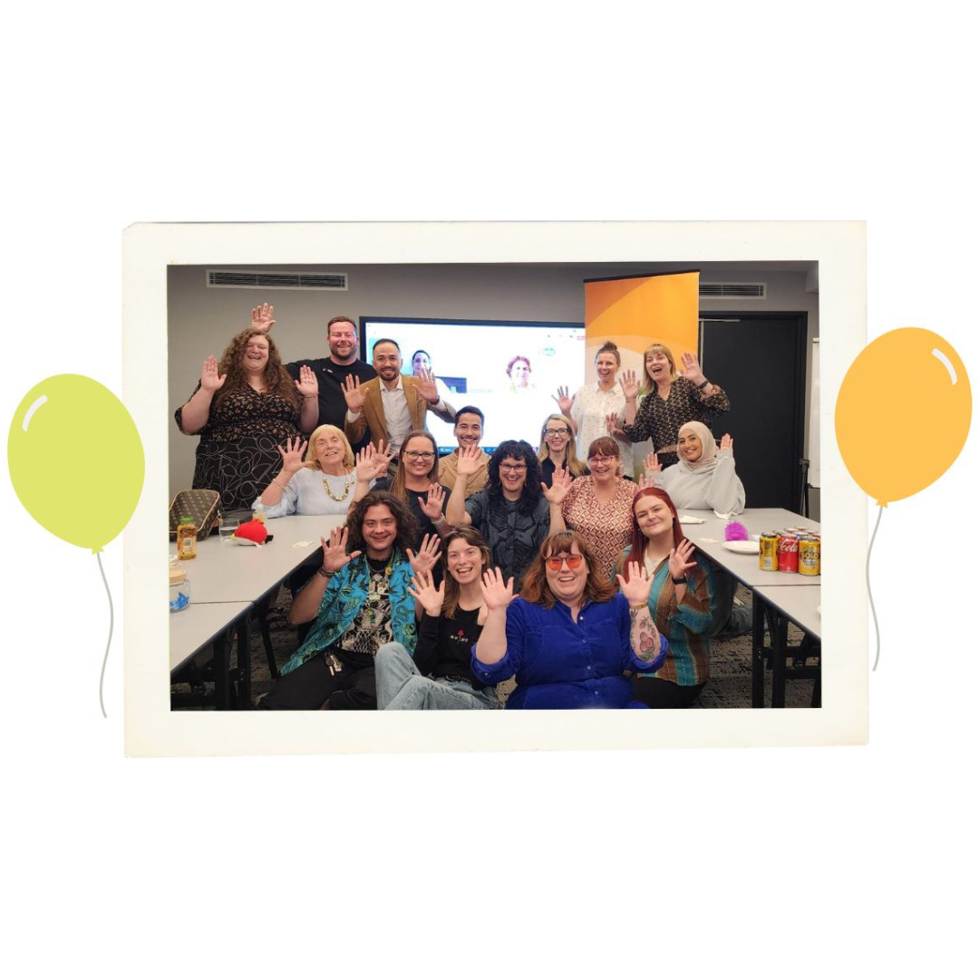 Polaroid image of all CYDA staff members waving happily with balloons surrounding