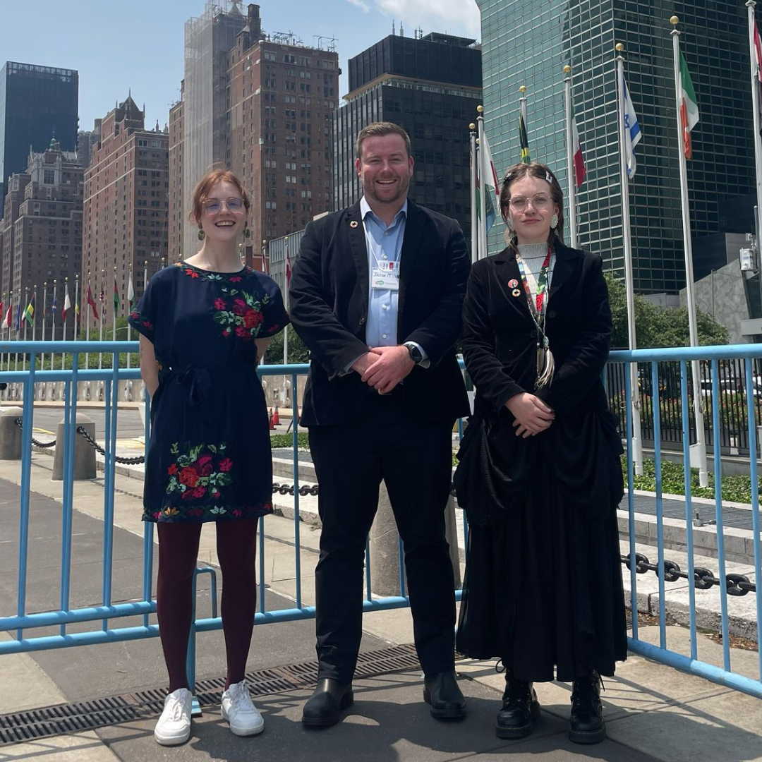CYDA delegates Ebe, Jason, and Gi stand together outside the UN